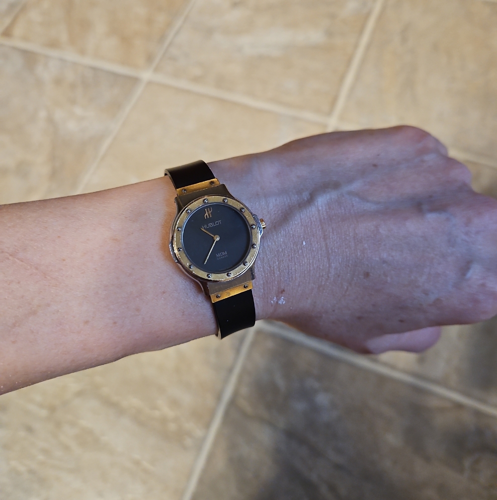 Hublot Black Dial Watch with Gold Bezel and Black Strap